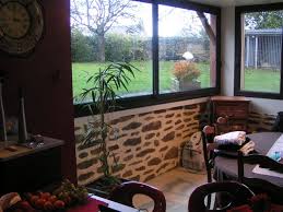 Photo de veranda avec muret. Interieur Veranda Habitat Conseil Renovation