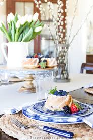 The rustic texture of the wooden table makes crisp blue and white napkins pop. Blue And White Table Setting Ideas For Spring On Sutton Place