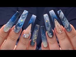 I can attest to this the shades of blue are accented with swirls and curls of glittering lines that emphasize the flow of the. Long Acrylic Nails Midnight Stars Blue Nail Design Youtube