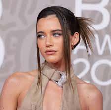 Olivia Neill does Y2K in low-rise cargo pants and a white tee