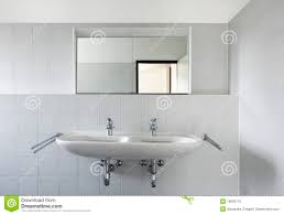 bathroom sink and mirror stock photo