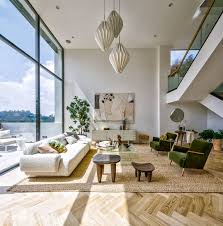 High Ceilings And Double Height Windows Keep This L A House Bright And Airy In 2020 High Ceiling Living Room Living Room Windows High Ceiling
