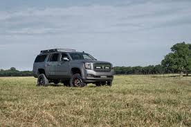 Off Road Modified Gmc Yukon Xl With Mud Tires And Roof Rack Gmc Yukon Roof Rack American Sniper Chris Kyle