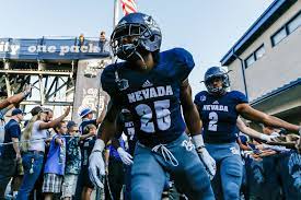 Defensive Back Daniel Brown Of The Nevada Wolf Pack Passes Fans On Nevada Wolf Pack Defensive Back Wolf Pack