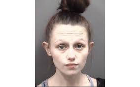 Woman charged in murder case booked back into jail for removing monitoring  device