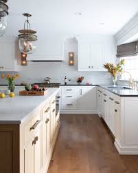 While white kitchen cabinets are classic and colorful kitchen cabinets are, we're ready for something a little moodier: 75 Beautiful White Kitchen With Black Countertops Pictures Ideas January 2021 Houzz