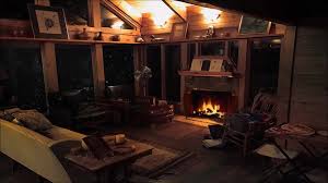 Cozy cabin in winter storm cabin fireplace burning in blizzard snow storm  for sleep, relax