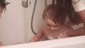 Bathing your baby may be daunting at first, but don't worry! Mother Washing Her Little Baby Boy In A Bath At Home Stock Video Footage Storyblocks