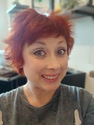 Who can do all over hair coloring and trim services in Sevierville?