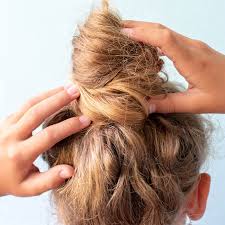 Then wrap it again only the second time only pull your hair part of the way through to leave some hair out of the bun you've just created. How To Do A Messy Bun The Perfect Messy Bun For Every Hair Type Ipsy