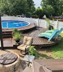 Our Semi Above Ground Swimming Pool And Curved Deck Swimming Pools Backyard Above Ground Swimming Pools Above Ground Pool Landscaping