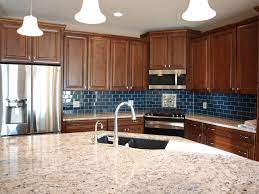 Maple Cabinets Granite Counters With Eating Bar At Island Blue Subway Tile Backsplash And Stainless Appliances Kitchen Remodel Maple Cabinets Custom Homes