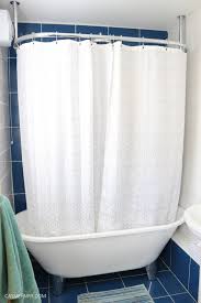 Freestanding bathtub with shower and wrap around curtain pole. How To Create A Shower Enclosure Over A Freestanding Bath