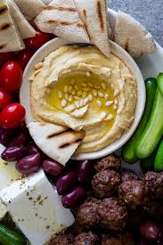 You roast the potatoes ahead of time, let them cool to room temperature, then throw them in for a quick heat & crisp while your meat is resting. Greek Mezze Platter Simply Delicious