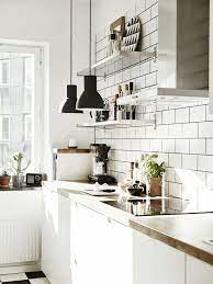 You must always let the sunlight in, but having it comes from the ceiling is genius! Scandinavian Apartment With Industrial And Mid Century Modern Touches Decordots Interior Design Kitchen Scandinavian Kitchen Design Home Decor Kitchen