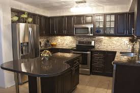 Dark wood cabinets with tan kitchen countertops. 10 Perfect Kitchen Backsplash Ideas For Dark Cabinets 2021