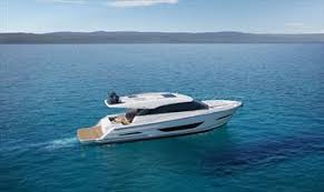 Cockpit seating around a teak table creates a nice outdoor gathering area protected by an overhang. Maritimo X60 Changing Of The Guard