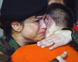 Michigan Army National Guard (MIARNG) Sergeant (SGT) Rita Ferguson, hugs  her son goodbye as she deploys with the 238th Combat Support Aviation  Battalion (CSAB). (A3596)