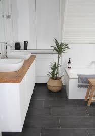 Our New Bathroom I Like The Combination Of Cold Elements Like White Walls And Grey Floor With Warm Elements Grey Bathroom Floor Grey Flooring Grey Floor Tiles