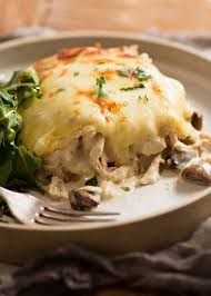 Think Tender Shredded Chicken And Golden Mushrooms Smothered In A Cheesy Creamy Alfredo Sauce Layered Up Into White Chicken Lasagna Chicken Lasagna Recipes