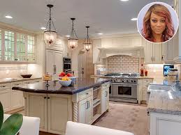 White and tan suburban house with 2 car garage and driveway with small lawn and mailbox dolly track establishing shot in nice neighborhood in big city or small town. Celebrity Kitchens Celebrity Homes Inside Celebrity Houses People Com