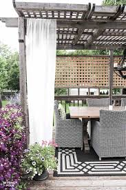 As promised i'm back today to show you how we hung our outdoor curtains with a really inexpensive solution for a diy outdoor curtain rod. Easy Diy Outdoor Curtain Rods In 10 Minutes Setting For Four