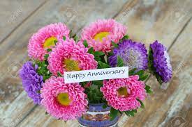 Maybe you would like to learn more about one of these? Happy Anniversary Card With Colorful Aster Flowers Bouquet On Rustic Wooden Surface Stock Photo Picture And Royalty Free Image Image 52044751