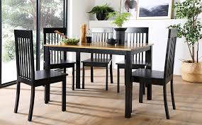 Start preparing the table's surface by sanding, then apply a primer.1 x expert source andres matheu commercial painter expert interview. Milton Painted Black And Oak Dining Table With 4 Oxford Black Chairs Furniture And Choice