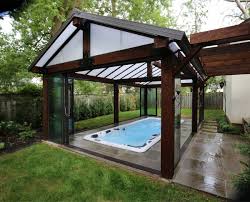 See all michael phelps models Comfortably Swim All Year Round By Enclosing Your New Swim Spa Indoor Swim Spa Pool Houses Swimming Pool Spa