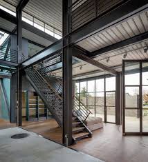 For this residence, an industrial style was chosen as a primary base for the interior design. Contemporary Industrial House Features An Expressive Interior Of Raw Steel