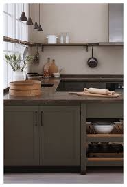 Gorgeous Kitchen With Olive Green Cabinets Deep Earthcolored Marble Counters And Natural Wood Accents Kitchenrenovation In 2020 Green Kitchen Cabinets Kitchen Interior Modern Kitchen