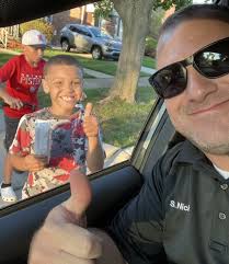 Freeze:' Lincoln Park police stop to hand out ice cream in 'copsicle  cruiser' to kids
