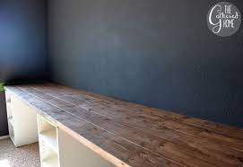 Ikea updated their kitchen cabinet offerings back in february 2015 that removed the 20 year old akurum style and replaced it with the new sektion. How To Make A Diy Plank Top Ikea Cabinet Desk Ikea Diy Ikea Schreibtisch Zuhause Diy