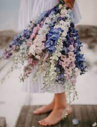 Colorful wildflower bouquets in lanterns. Romantic Hand Held Floral Bouquet Delphinium Wedding Bouquet Delphinium Weddings Wildflower Bouquet