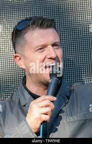 Preston, Lancashire. 20th May, 2019. Tommy Robinson aka Stephen Yaxley  Lennon, former EDL leader, political activist, author visits town. Hundreds  of supporters attend Ashton Park during Tommy Robinson's campaign visit to  Preston.