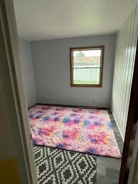 Please help me choose. Any additional advice is appreciated. 😭 Rainbow  rug, rainbow wallpaer mural, light teal paint continuing into kitchen. 👍  Earthy and colourful wallpaper mural amd rug with light teal