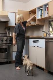 Using a paint color that matches your kitchen decor, and the fabric you picked out, paint the cabinets and let them dry completely. How To Decorate Ugly Cabinets