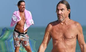 Iggy pop hits the daytime schedule with a seasonal sonic cocktail for christmas day. Iggy Pop Enjoys Miami Beach As Dirty Little Virus Track Released Daily Mail Online