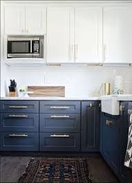 Love This Look Dark Blue Cabinets With Long Gold Pulls White For The Rest Shaker Colorful Or Modern Kitchen Remodel Kitchen Remodel Small Modern Kitchen