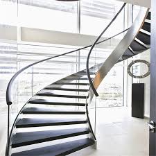 This project was designed to hide the stringer and structure inside the wall. China Luxury Villa Staircase Design Stainless Steel Stringer Curved Glass Stair China Glass Stair Curved Glass Stair