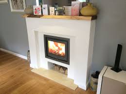 Buy top brands at discounted many of the inset wood burning stoves have a clean contemporary look to fit in any modern simple surroundings. Modern Fireplace Surround With Inset Log Burner Headley Hampshire Log Burner Installation Hampshire