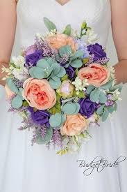 A bridal bouquet with purple and white flowers is a natural pairing, but purple complements many other colors. Romantic Theme Wedding Flower Brides Bouquet With Peach Bellini Peach Regency Purple Wedding Bouquet Fake Flowers Wedding Flower Guide Peach Wedding Flowers