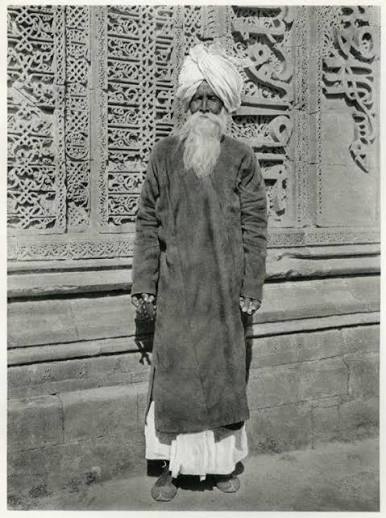 Portrait of a Fakir in front of the Adhai-din-ka-jhonpra Mosque at Ajmer, India - 1928 - Old Indian Photos