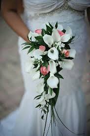Bouquet of flowers for an anniversary. Pretty Cascading Bridal Bouquet Of White Calla Lilies Pink Spray Roses White Stock Floral With Green Lily Bridal Bouquet Waterfall Wedding Wedding Bouquets