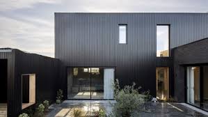 Accentuate your interior design with tasteful floor lamps, furniture, tv stands, and accent tables! All Black Modern House For Sale Conceals Crisp Clean Interior Curbed