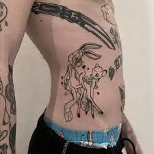Not surprisingly, bugs bunny tattoos are wildly popular, often portrayed with bugs wearing a costume of sorts or perhaps simply his bare grey and white coat. Terrible Tattoos Bugs Bunny Fucking Bambi And A Mall Ninja Topper H3h3productions