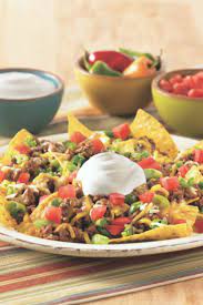 Loaded Beef Nachos Recipe With Sour Cream Daisy Brand Recipe Recipes Nachos Recipe Beef Mexican Food Recipes