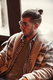A man bun fade is a men's hairstyle that blends two hairstyles together. Man Bun With Skin Fades On Side Royal Rhino Club Barbershop