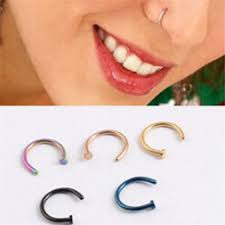 Insert the rest of the ring into the hole until the bottom of the hoop slides towards the center and the opening lies directly below it. Hoop Nose Rings That You Need To Look Stunning