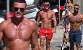 See more of luke evans on facebook. Actor Luke Evans Flaunts His Ripped Physique In Tiny Red Shorts At Sydney S Bondi Beach Daily Mail Online
